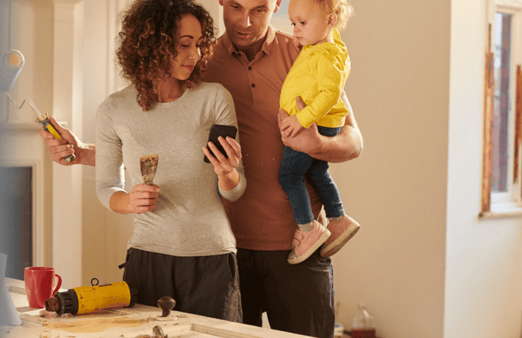 Image of a family including ma, woman and child decorating home. Claddagh Credit Union mortgage